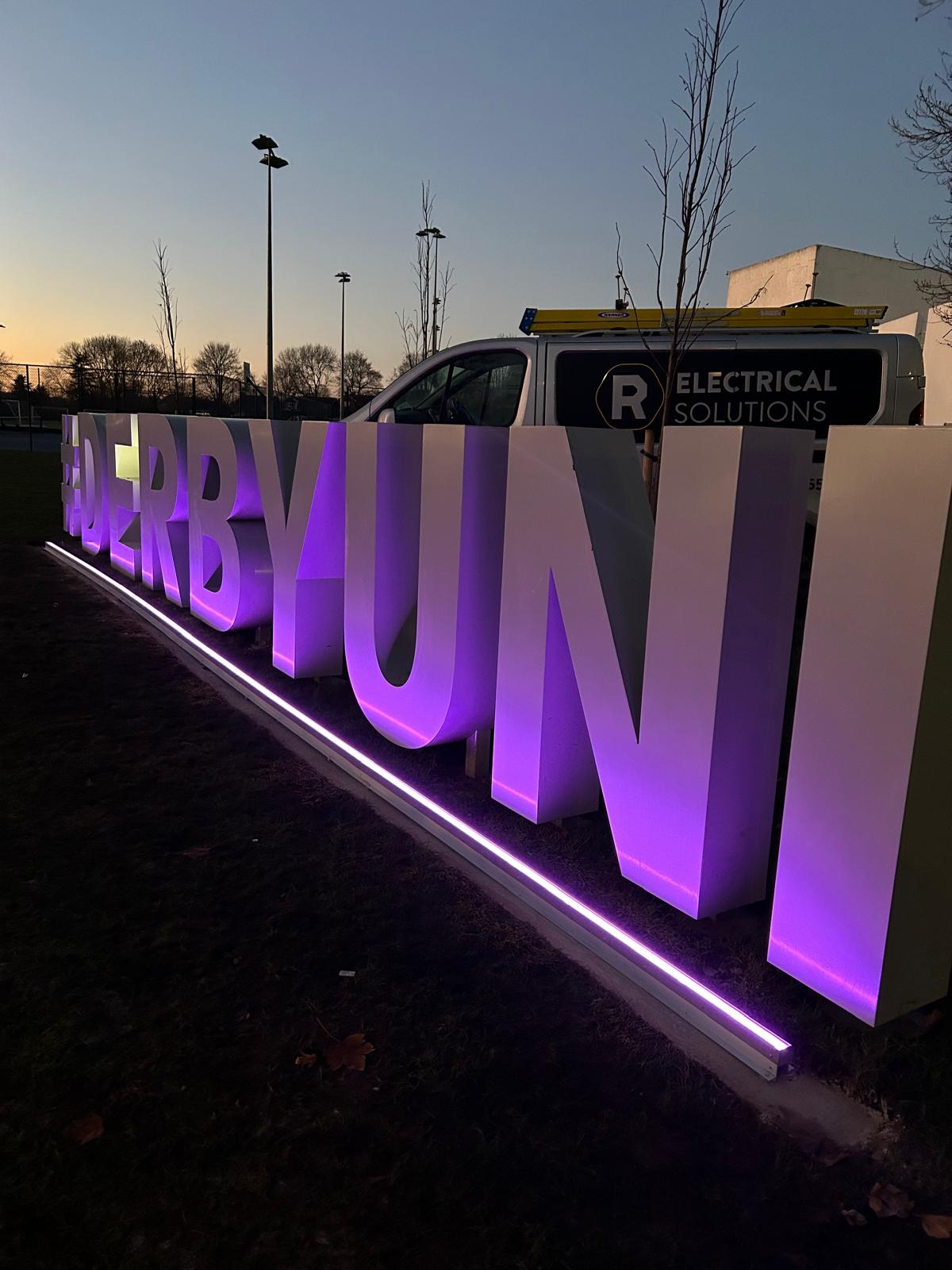 Exterior building signage illuminated with colour-changing LED lighting installed by R Electrical Solutions