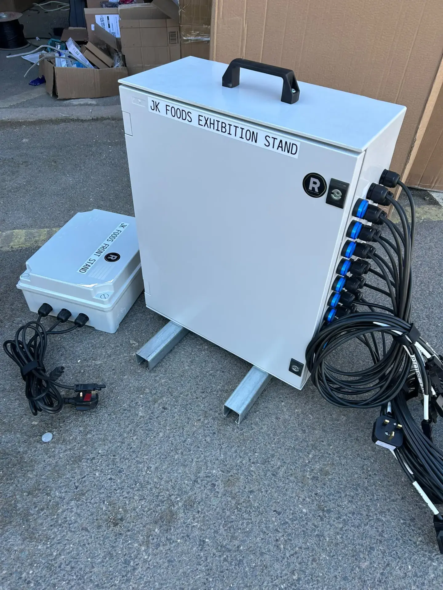 Custom-built distribution enclosure with labelled multi-outlet connectors and pre-made cable looms